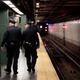 New York City police officers patrol a subway station in Times Square on Nov. 7, 2016.
Drew Angerer/Getty Images